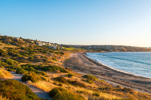 Panoramic view of Hallett Cove beach and houses along the coast at sunset - Australian Stock Image