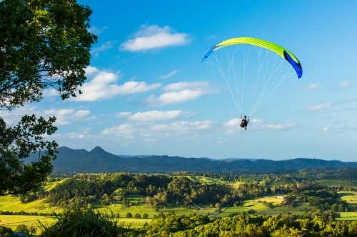 Paragliding above the hinterland near Byron Bay in the Northern Rivers. - Australian Stock Image