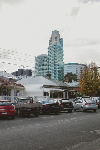 Parked cars in Albert Park with view to city buildings in Melbourne CBD - Australian Stock Image