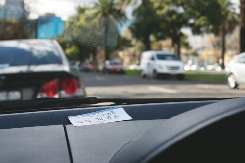 Parking ticket placed on car dashboard in Melbourne inner city - Australian Stock Image