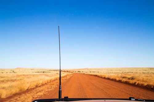 Passenger view driving on dirt road - Australian Stock Image