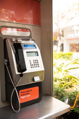 pay phone booth in a public shopping mall - Australian Stock Image