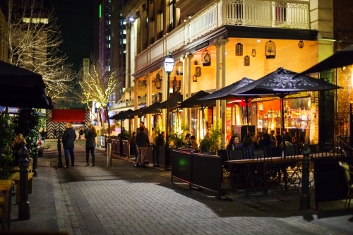 People in laneway restaurant at night - Australian Stock Image