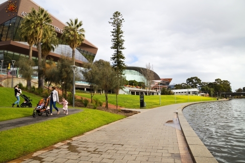 People walking along riverbank area - Australian Stock Image