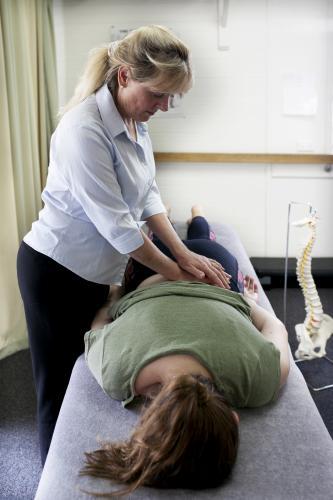Physiotherapist treating patient - Australian Stock Image