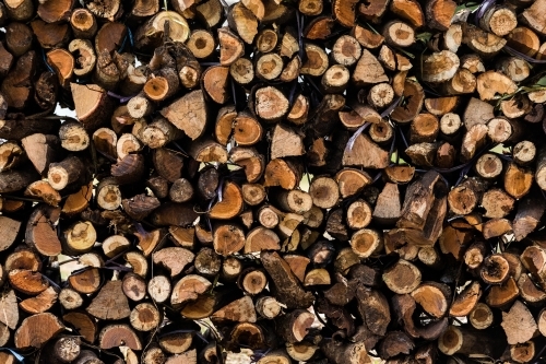 pile of chopped firewood - Australian Stock Image