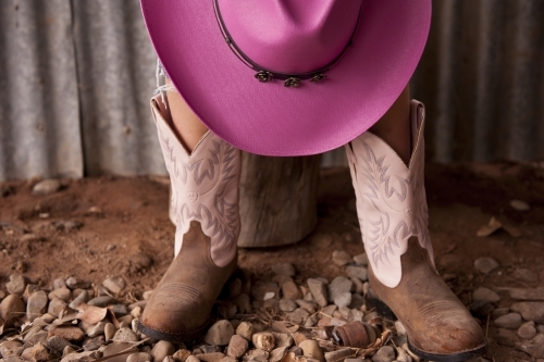 Pink cowgirl hat and boots - Australian Stock Image