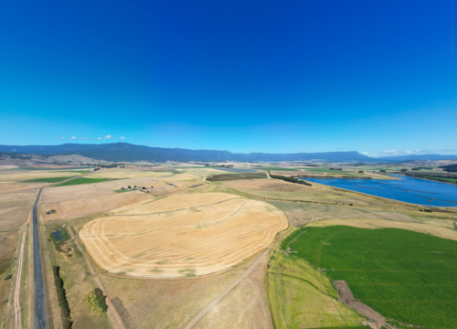 Poatina and surrounding rural landscape of the Western Tiers on a warm summer's morning in Tasmania - Australian Stock Image