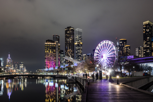 Polly Woodside Park and ferris wheel and Melbourne skyline as seen at dusk. - Australian Stock Image