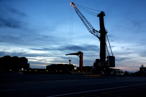 Port in silhouette with crane - Australian Stock Image