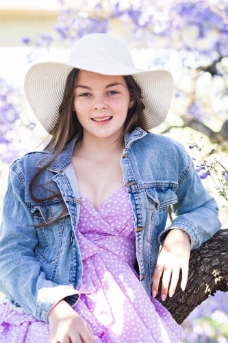 Portrait of Young Woman in Purple Hat, Shimmering Pants and