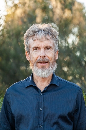 Portrait of a bearded middle aged man outside