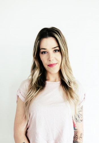 Portrait of a girl in her 20s on white background - Australian Stock Image