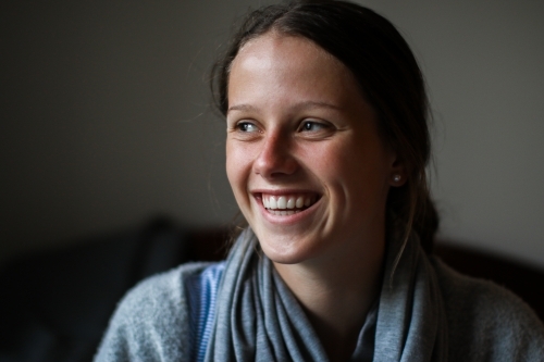 Portrait of a happy young teenage girl indoors - Australian Stock Image