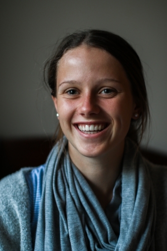 Portrait of a happy young teenage girl indoors - Australian Stock Image