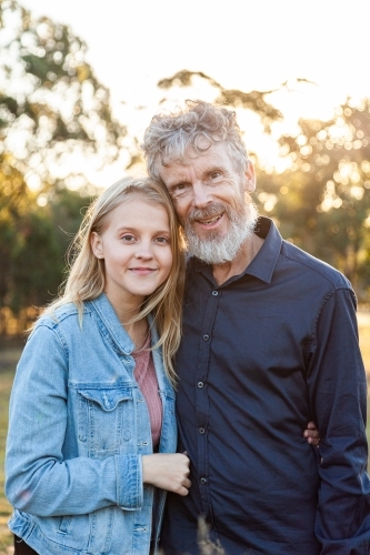 Portrait of a smiling man and his daughter - Australian Stock Image