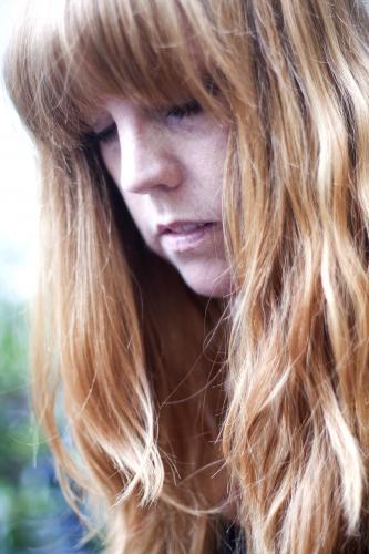 Portrait of a woman with red hair - Australian Stock Image