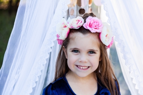 Portrait of a young girl in a floral headpiece - Australian Stock Image
