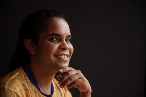 Portrait of Aboriginal woman looking at the camera - Australian Stock Image