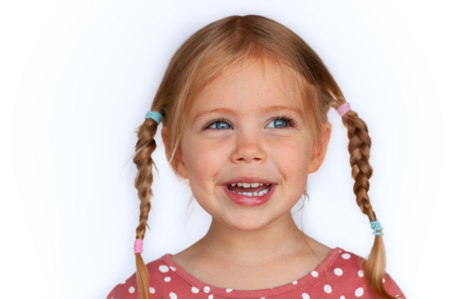 Portrait of smiling young Australian Caucasian child on white backdrop - Australian Stock Image