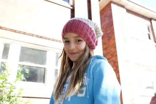 Portrait of young girl in front of apartment building - Australian Stock Image
