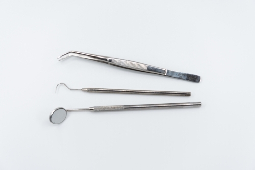 Professional dental instruments on white background - Australian Stock Image