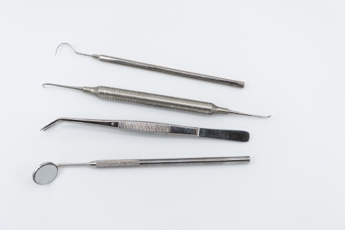 Professional dental instruments on white background - Australian Stock Image