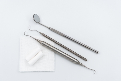 Professional dental instruments on white background - Australian Stock Image