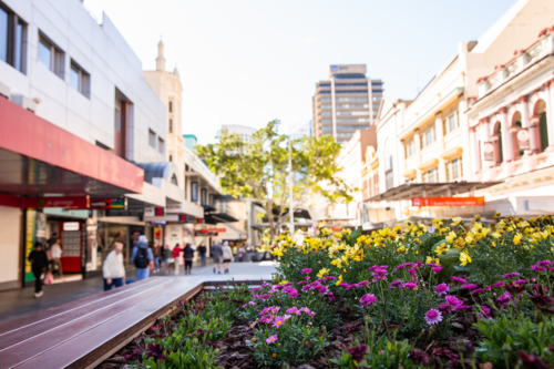 Queen Street mall gardens, shop fronts and pedestrians in Brisbane - Australian Stock Image