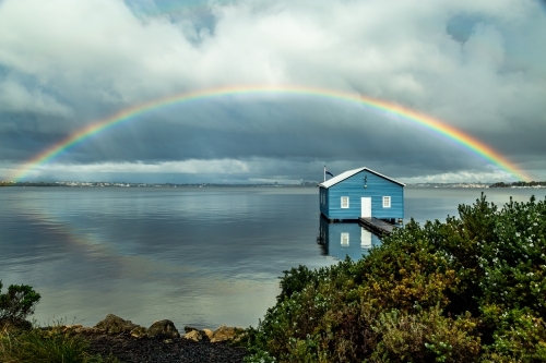 Rainbow over Crawley Edge blue boatshed, Perth, Western Australia, Australia