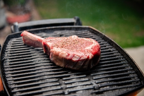 Raw Steak on a BBQ - Australian Stock Image