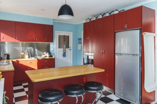 Red and teal retro kitchen interior