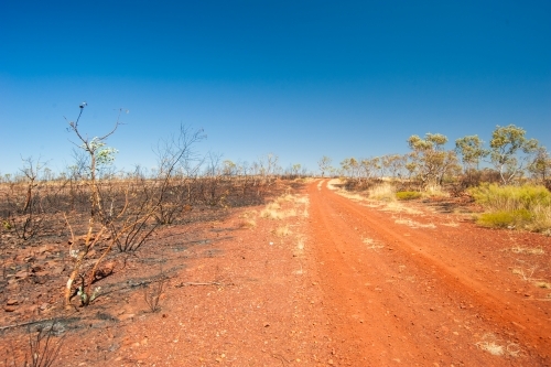 Red dirt track in Northern Territory - Australian Stock Image