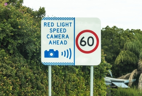 Red light speed camera ahead warning sign and 60 sign - Australian Stock Image