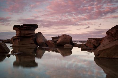 Reflection of rocks at the beach