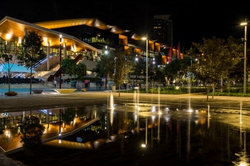 Reflection of the night lights in the forecourt fountain at Darling Harbour, Sydney