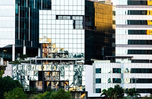 Reflections and geometric patterns in city buildings creating abstract effect - Australian Stock Image