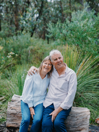 Retired senior couple sitting together enjoying healthy lifestyle in nature - Australian Stock Image