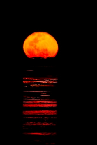 Ripples of light across water like a staircase to the moon - Australian Stock Image
