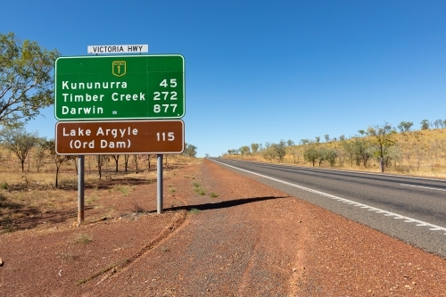 roadside view of road sign near Kununurra on the Victoria Highway - Australian Stock Image