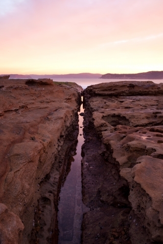 Rocks and water at sunset - Australian Stock Image