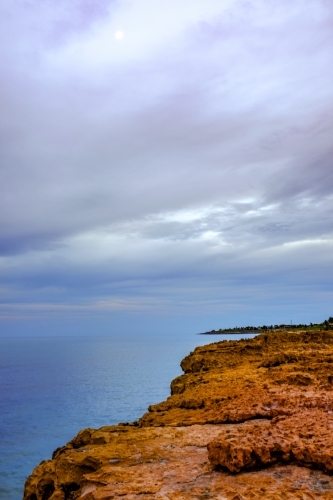 Rocky coastline with ocean and blue sky - Australian Stock Image