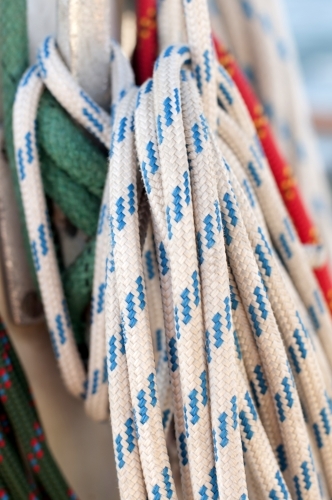 Rope wound around a hook on a sailing boat - Australian Stock Image