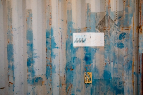 Rust and paint on corrugated metal of an old shipping container - Australian Stock Image