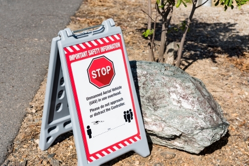 Safety warning sign, do not distract the pilot flying his drone, uav, rpas - Australian Stock Image