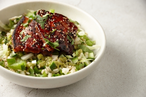 Seared eggplant with brown rice salad - Australian Stock Image