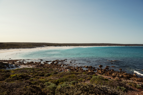 Seascape of long white sandy beach - Australian Stock Image