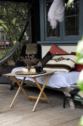 Seat and table on outdoor patio - Australian Stock Image