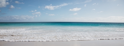 Seaward view of empty beach in the morning - Australian Stock Image