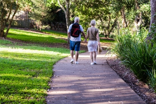 senior couple on nature walk - Australian Stock Image